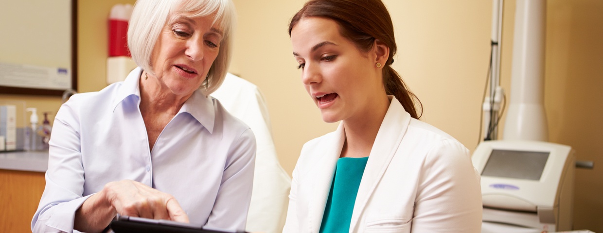 woman and doctor talking, postoperative care concept, discussing complications woman and doctor talking, postoperative care concept, discussing complications