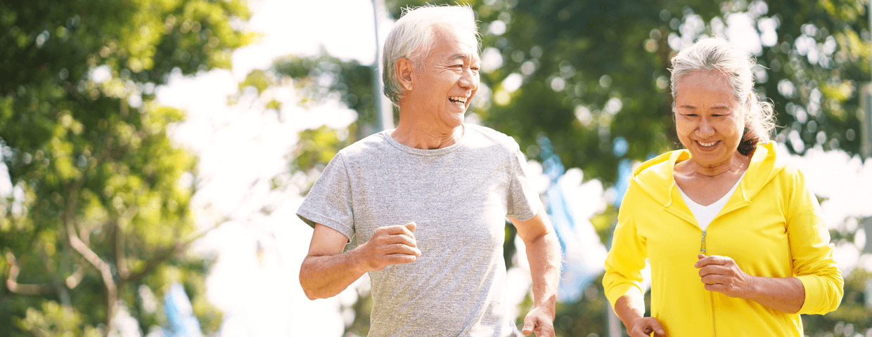 happy asian senior couple running exercising outdoors in park, exercise for heart health