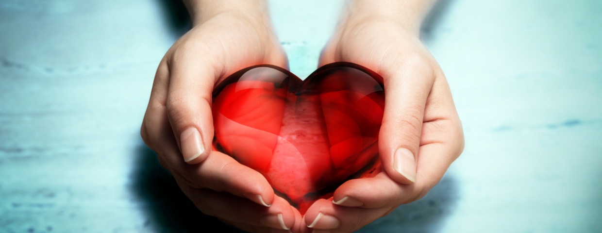 holding heart in hands to represent cardiac rehab