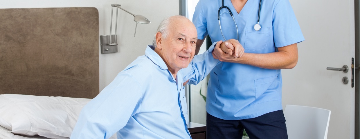 old man supported by nurse old man supported by nurse