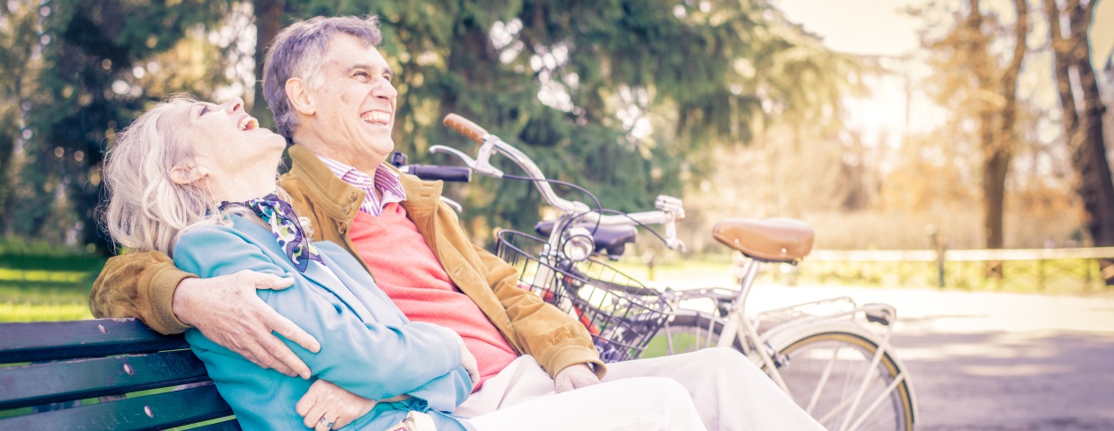 older couple sitting on park bench older couple sitting on park bench