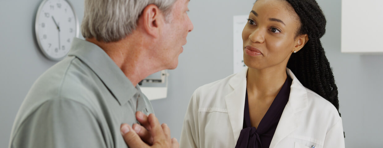 patient and doctor having a conversation about recommended postoperative care devices, sternal support device, heart hugger