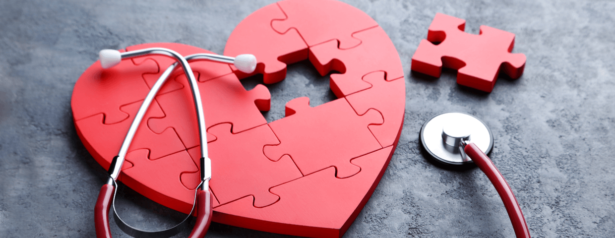 Red puzzle heart with stethoscope, heart surgery and recovery concept