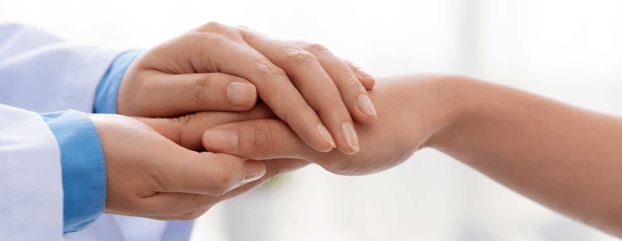 Doctor Hands Holding Patients Hand