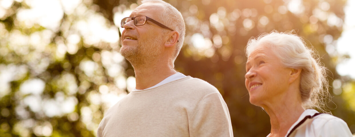 senior couple walking outside